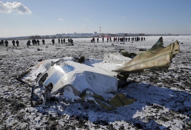 Emergencies Ministry members work at the crash site of a Boeing 737-800 Flight FZ981 operated by Dubai-based budget carrier Flydubai, at the airport of Rostov-On-Don, Russia, March 20, 2016. REUTERS/Maxim Shemetov